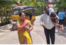 పెన్షన్ కోసం బిడ్డను భుజాన మోసుకుని కలెక్టరేట్కు.|
